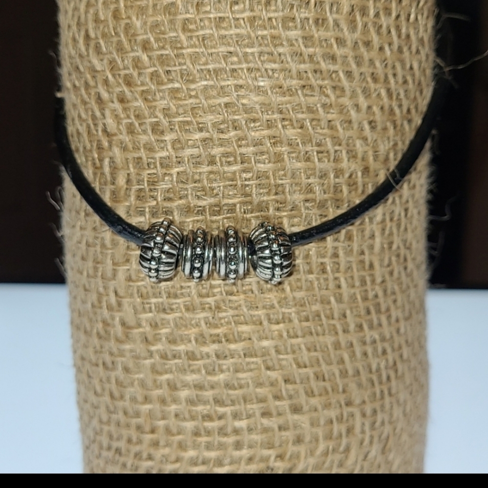 16" Black leather choker with 4 silver beads.